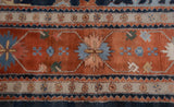 Terracotta field's large blue palmette, stylized floral ivory border, vintage Bijar design.