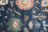 Large terracotta palmettes and floral vinery on dark denim blue of a vintage Indian Bijar rug.