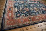 Vintage Indian Bijar carpet corner with intact fringe, navy blue selvage, and terracotta floral border.