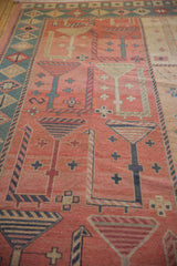 Pictorial Soumac design with stylized geometric forms in dusty rose, charcoal, and teal.