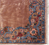 Vintage Indian Arts and Crafts carpet corner with floral arabesques, palmettes, and flowing vinery.