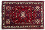Vintage Persian Abadeh rug in cherry red and navy blue with a stepped diamond medallion and a field of bird motifs.