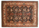 Vintage Agra rug corner detail with rich navy, madder red Safavid-style floral vinery.