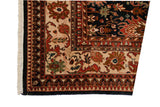 Vintage Agra carpet corner showing cream border, nuanced arabesque details, and dark floral field.