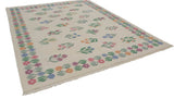 Corner of vintage Romanian Kilim with colorful floral border and staggered bouquets on ivory.