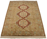 Angled perspective of a vintage Bulgarian carpet, centered by a column of three red medallions.