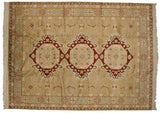 Vintage Bulgarian carpet with a triple wine-red medallion design on a sand field with geometric floral accents.