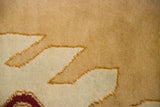 A detailed view of the like-new full pile height and hand-knotted texture of the vintage carpet.