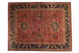 Vintage Agra carpet with oversized medallions, interconnected vinery, and a palmette border in copper and navy blue.