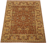 Angled view of the new Agra carpet's copper field and wide, Safavid-inspired wheat border.