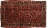 Vintage American Sarouk carpet with allover floral sprays on a ruby red field and an intricate navy blue border.