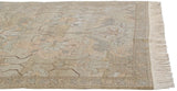 Oversized floral pattern, narrow banded main border, and fringe on the vintage Armenian Sultanabad carpet.