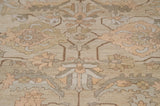 Curvilinear vinery and floral motifs in ivory, beige, and oxidized silver.