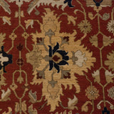 Detail of an oversized floral bud with interconnecting vinery in navy, wheat, and terracotta.