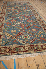 Angled view of an Armenian Veramin runner's repeating floral lattice design and soft, full pile.