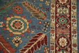 Weaver's insignia and floral motifs on the dense denim blue pile of a vintage Armenian rug.
