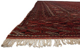 View along the original side cord and ivory fringe of a vintage fine Bokhara carpet.