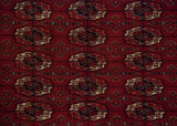 Finely woven gul medallions in cherry red, navy, and ivory on a vintage Bokhara carpet.