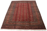Angled view of a vintage Bokhara carpet showing rows of gul medallions and complex geometric borders.