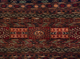 Detail of the tight, fine weave and gul medallions on a vintage Pakistani Bokhara carpet.