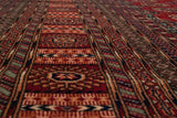 Perspective shot highlighting the fine weave and plush, lustrous pile of a vintage Bokhara carpet.