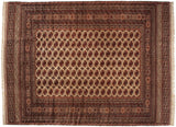 Oversize vintage Bokhara carpet with a repeating pattern of rust and navy gul medallions across an ivory field.