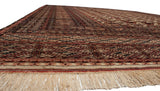 Low angle view of a Bokhara carpet showing its lustrous wool pile and repeating gul design.