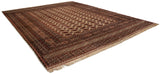 Angled view of a vintage Bokhara carpet, highlighting its full-bodied wool pile and intricate borders.