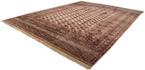 Angled view of a large vintage Bokhara carpet, highlighting its lustrous wool pile and geometric pattern.
