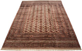 Full-length view of a vintage Bokhara carpet with repeating gul medallions and a lustrous wool pile.