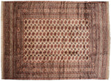 Symmetrical layout of a vintage Bokhara carpet showing columns of detailed rust gul medallions.