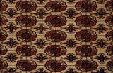 Plush, even wool pile showcasing the detailed gul medallions of a vintage Bokhara rug.