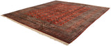 Lustrous wool pile and ivory fringe on a vintage square Bokhara carpet, viewed from an angle.