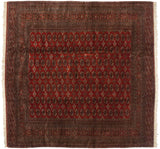 Fine Pakistani Bokhara rug with repeating gul medallions in a field of deep cherry red and navy.