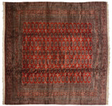 Finely woven Pakistani Bokhara carpet with a symmetrical grid of guls on a lustrous red field.