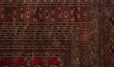Intricate multi-column borders with gul medallions on a hand-knotted vintage Bokhara style carpet.