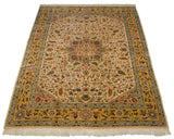 Full length view of a vintage Bulgarian Isfahan carpet, emphasizing its saffron border and intricate ivory field.