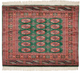 Even, plush wool pile and intact ivory fringe on a vintage fine Bokhara square rug.