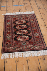 Angled view of a fine Bokhara rug showing the lustrous pile and gul medallions.