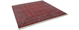 Vintage Bokhara square carpet with a repeating cherry red gul pattern and neat ivory fringe.