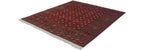Fine Pakistani Bokhara carpet from an angle, showcasing its lustrous red pile and clean ivory fringe.