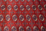 Plush, high-sheen wool pile showing gul medallions in cherry red, navy blue, and ivory.