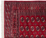 Fine weave of the repeating gul medallions and detailed geometric borders of a Bokhara rug.