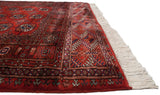 The intact side cord selvage and detailed geometric border on a plush vintage Bokhara rug runner.