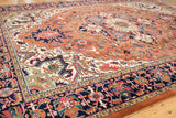 Vintage Indian Heriz design rug's rust, navy, ivory geometric floral detail and intact selvage.