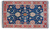 Sprawling palmettes and floral vinery on a sapphire blue field in a vintage Indian Bijar rug.