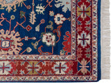 Close-up of the vintage rug's dense pile, original side cord selvage, and clean ivory fringe.