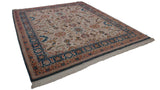 Denim blue palmette border, terracotta guard band, and ivory fringe on vintage Indian Sultanabad design carpet.