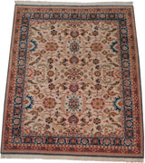 Vintage Indian Sultanabad rug corner, denim blue and terracotta borders, ivory palmettes.