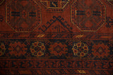 Fine, dense wool pile showing the detailed gul medallion of a vintage Afghani Bokhara rug.